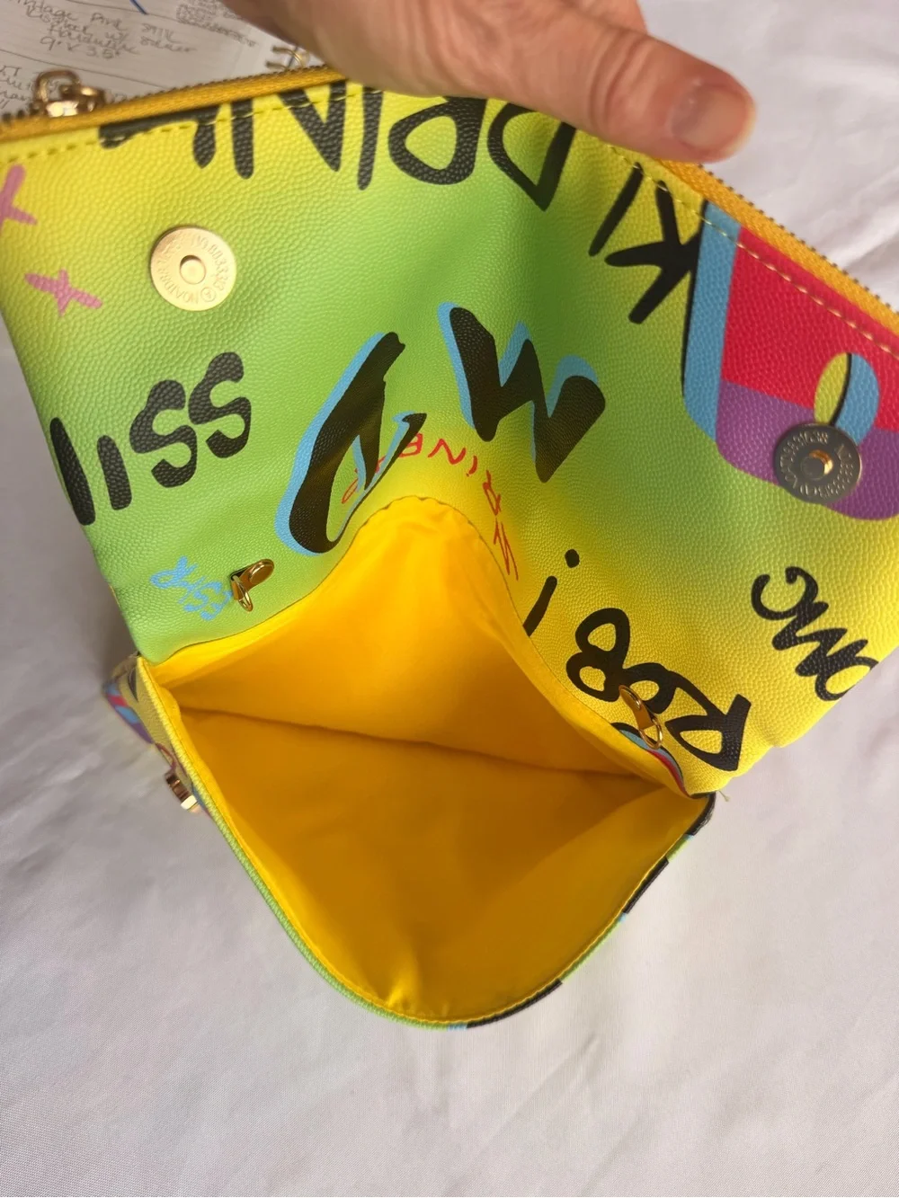 AKIRA Graffiti Multicolor Fold-Over Clutch Bold Letters Bright Yellow Interior